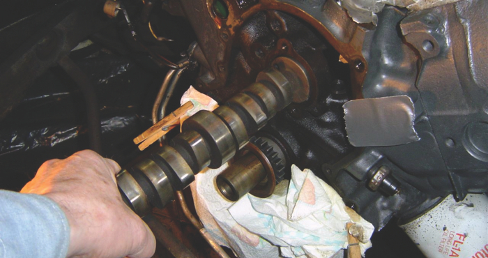 Old camshafts are often worn camshafts. If the lobes don’t measure up, don’t reuse the cam. Also never use new lifters with a worn cam or vise versa. New parts don’t mate well with worn surfaces.