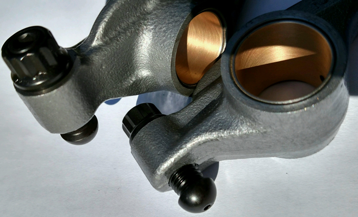 Duramax rocker arm with billet tool steel adjusters and lighter weight poly lock jam nut.